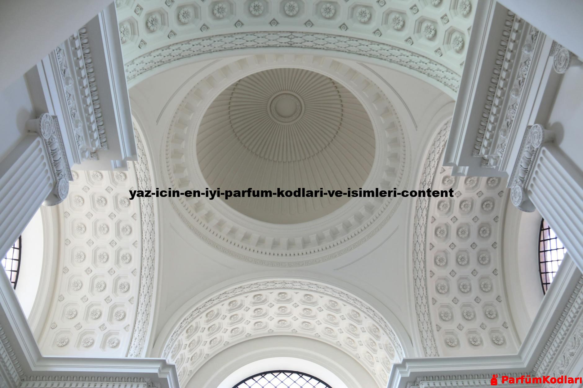 A stunning view of an ornate white dome ceiling with intricate architectural details.