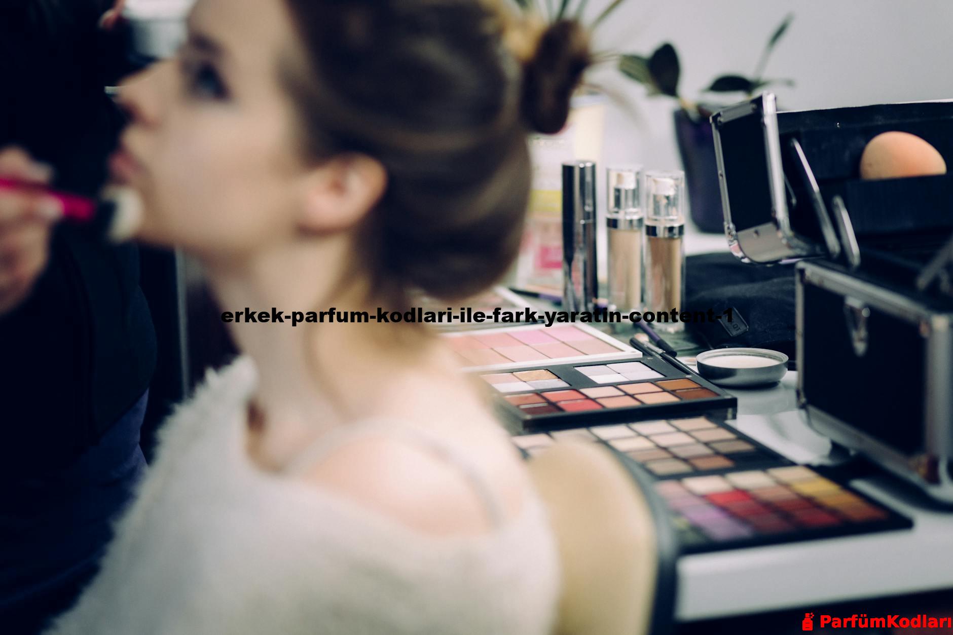 A woman receiving professional makeup in a studio with various cosmetics in focus.