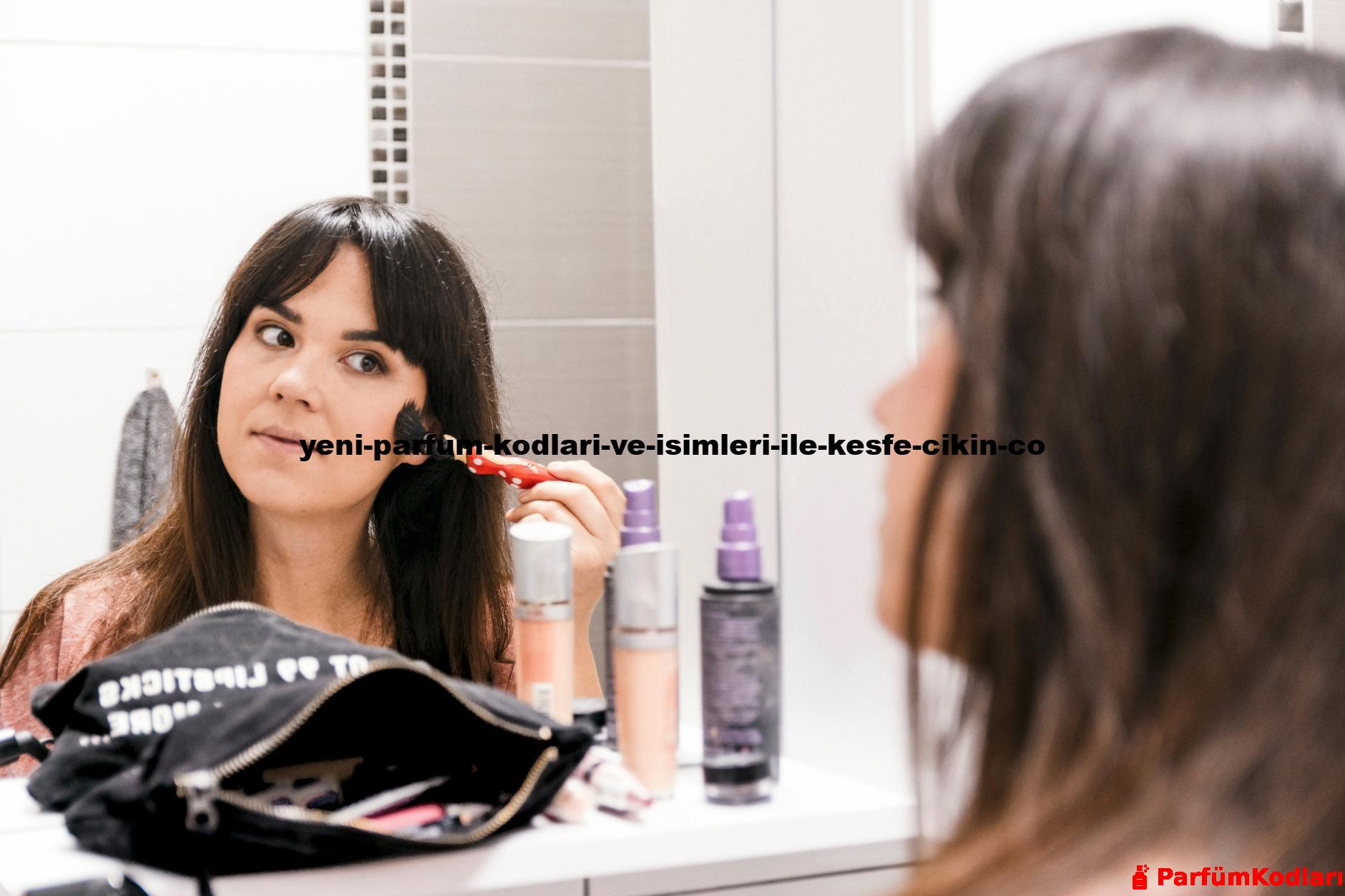 A woman applying makeup using a brush in front of a bathroom mirror, surrounded by cosmetics.